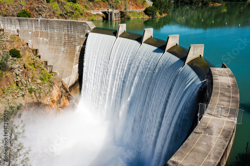 Water spills over the top of Englebright Dam on the Yuba River. A larger than normal snowpack in the Sierra Nevada Mountains has increased runoff into lakes and rivers in California.