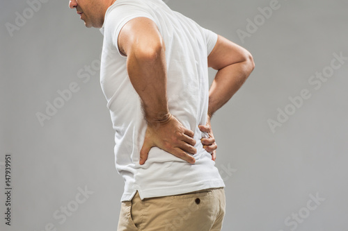 close up of man suffering from backache