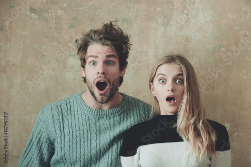 Wow! Surprised man and woman with open mouth, young couple