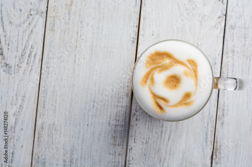 latte macchiato coffee on white wooden background. Top view