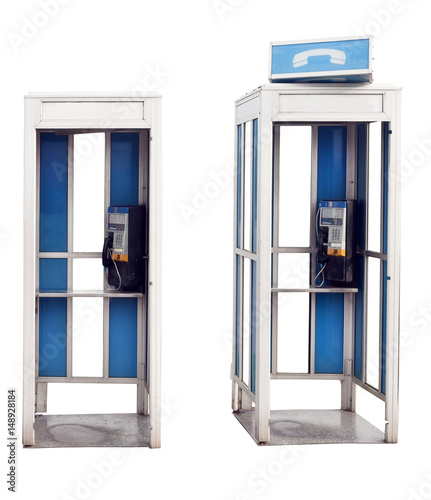 Two isolated vintage outdoor phone booths.