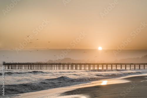 Hazy Sunset over Seacliff State Beach. Aptos, Santa Cruz County, California USA.