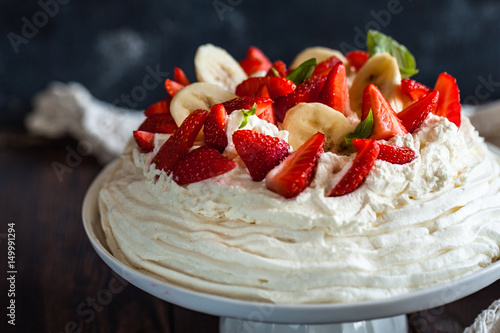 pavlova, meringue cake with strawberries and bananas