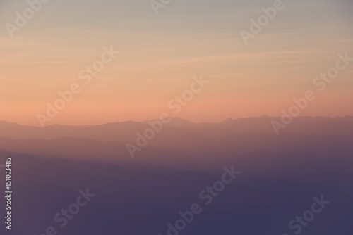 beautiful sunset and foggy mountain valley landscape.