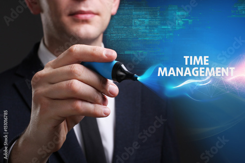 Business, Technology, Internet and network concept. Young businessman working on a virtual screen of the future and sees the inscription: Time management