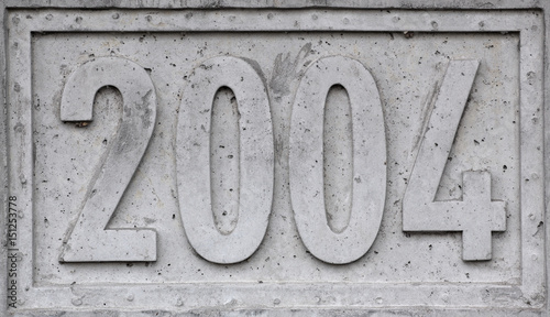 Concrete block with the year 2004 engraved