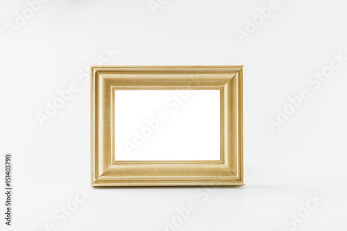Blank gold picture frame on white background