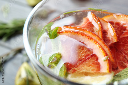 Glass with fresh citrus cocktail, closeup