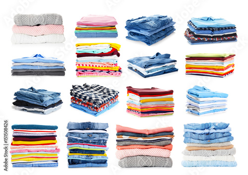 Stacks of folded clothes on white background