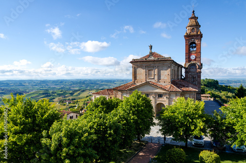 Main square of Diano d'Alba (Piedmont, Italy), town in the hills of Langhe, with the gardens and the church of San Giovanni