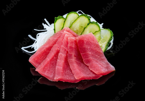 Tuna sashimi over black background,