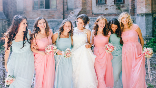 Beautiful bride with her pretty bridesmaids