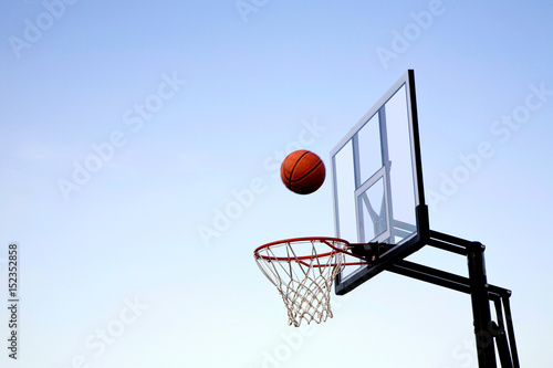 Basketball Midair Going into Hoop