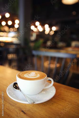 cappuccino coffee on wood background