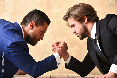 arm wrestling of businessman and compete man