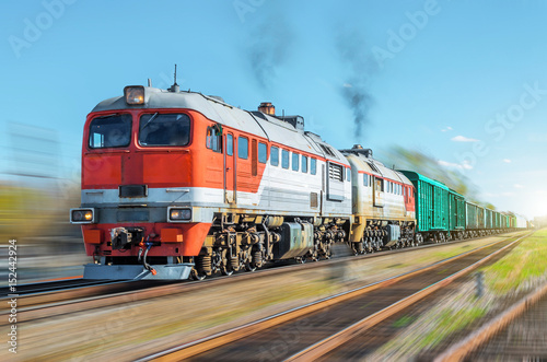 Freight train blur motion railroad embankment rail.