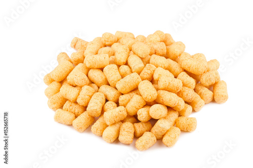 side view of corn puff snacks pile isolated on white