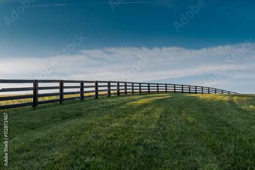 Three Quarter View of Fence Over Rolling Hill
