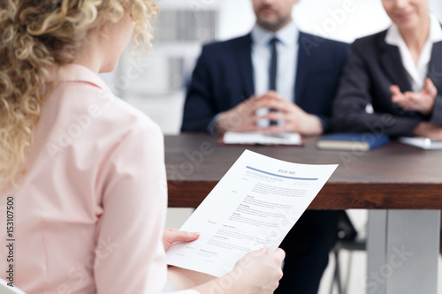 Woman holding her resume