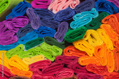 Rolls of coloured crepe paper for creative artworks, close up