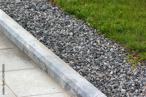 Border kerb between lawn and sidewalk in a park