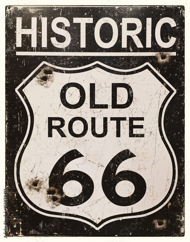 Sepia effect retro sign for the historic old Route 66 in America. Faded, vintage style with bullet holes. 