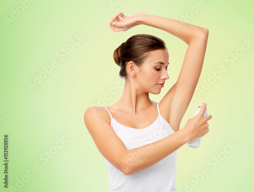woman with antiperspirant deodorant over white