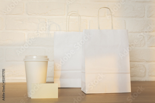 White shopping bags and coffee front
