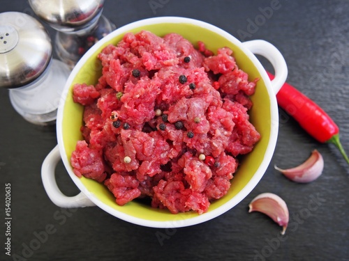 Minced beef on black background