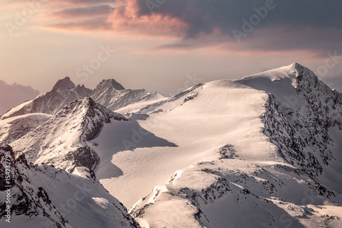 Mystic mountain landscape scenery with dark clouds in the alps