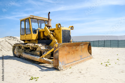 crawler caterpillar bulldozer used to push sand on beach