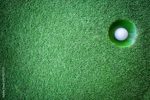 Mini golf scene with ball and hole