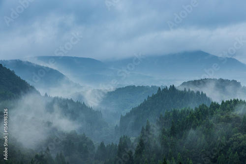 Beautiful mountain range covered with fog and rain in Yufuin, Oita, Japan