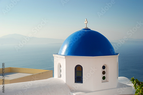 Iconic blue domed church in Santorini Greece