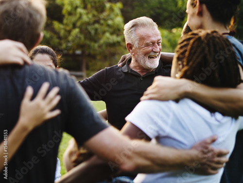 Happiness group of people huddle and smiling together