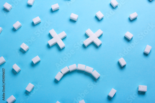 Smiley dead from cubes of sugar. Sugar kills