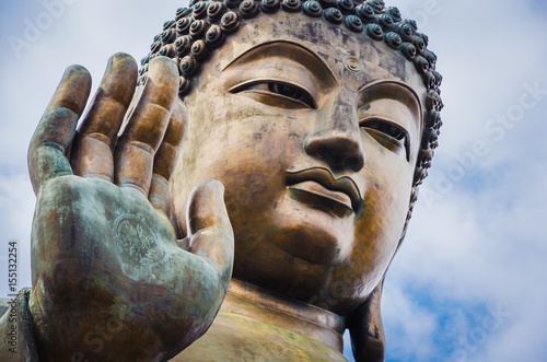 Close up of Tian Tan Buddha with details of hand - The worlds's tallest outdoor seated bronze Buddha located in Lantau Island, Hong Kong, China