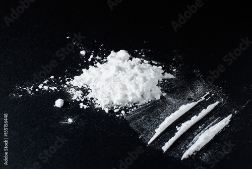 Heroin divided into paths on a black background