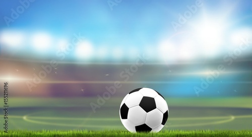 football stadium blurred background with ball and grass 3d rendering