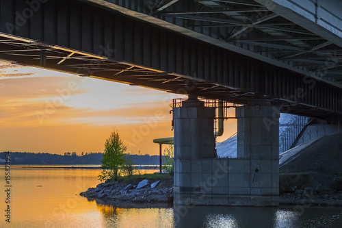 Railway bridge over the evening river. Berdsk, Siberia, Russia