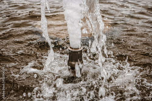 Jet of fountain closeup, ejaculation concept.