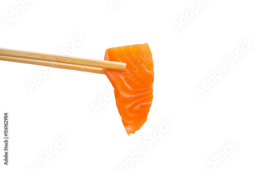 Salmon slice sashimi in chopsticks isolated on white background