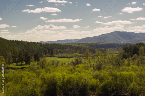 landscape with forest on the background of the Ural mountains on a clear Sunny day
