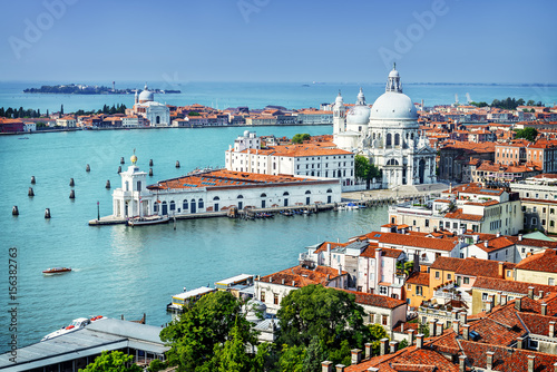 Beautiful view of the Grand Canal and Basilica Santa Maria della Salute in the late evening with very interesting clouds, Venice, Italy