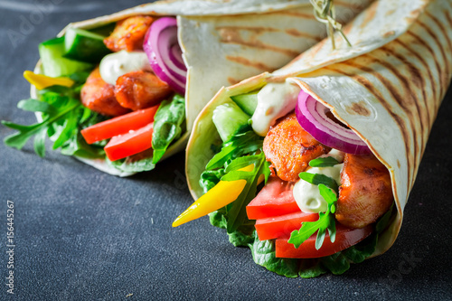 Delicious grilled tortilla with fresh vegetables and chicken