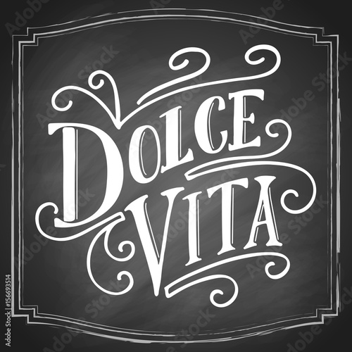 Dolce vita hand drawn lettering on black chalkboard background, italian phrase Sweet life. Vintage vector design.