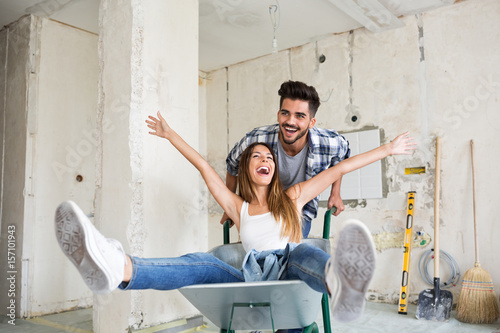 Loving couple is having fun while renovating their home