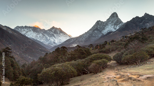 Sunrise in Himalayas. Ama Dablam, Nuptse, Lhotse and Everest in first rays of sun. Two eight-thousander peaks. View from Tengboche. Sagarmatha National Park, Solukhumbu District in Nepal, Asia. 