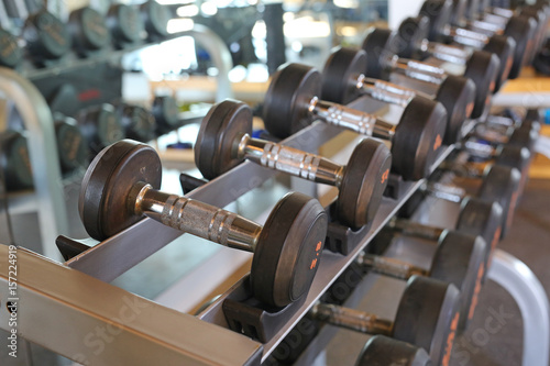 Closeup of dumbbells in gym.