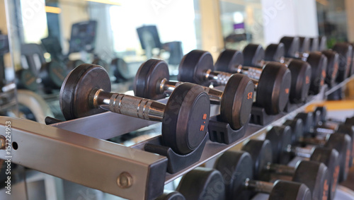 Closeup of dumbbells in gym.